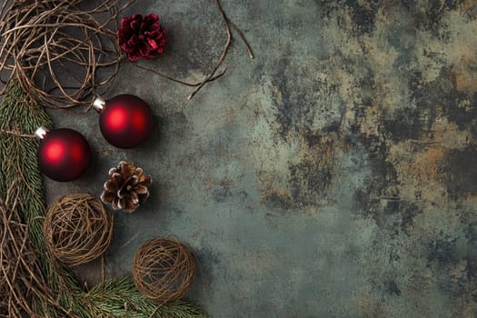 Festive red ornaments and natural elements create a seasonal display enhancing the atmosphere for winter celebrations and holiday gatherings.