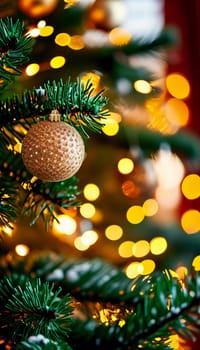 Sparkling ornament balls in vibrant gold hang from a lush spruce tree branch. Soft, warm lights twinkle enhancing festive spirit of Christmas. Happy New Year. Anamorphic  bokeh. Generative AI.