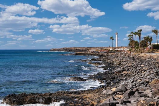 View of the Coast of Playa Blanca with the Faro de Punta Pechiguera lighthouse on the canary islands