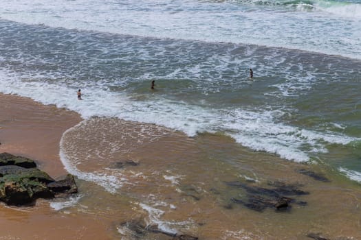Sintra, Portugal: April 13, 2024: People at the beach of Ericeira, Mafra, Portugal