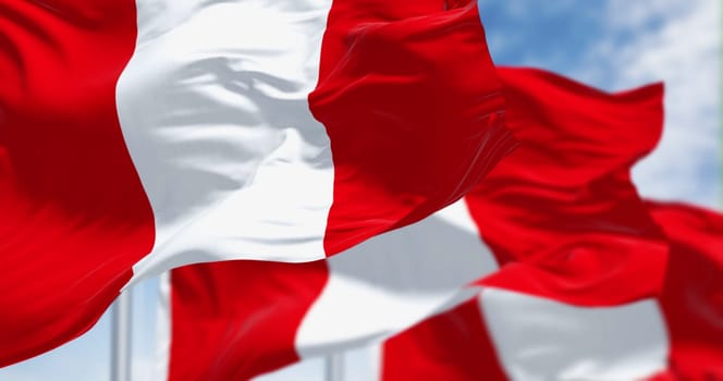 Close-up view of Peru national flags waving in the wind. The Republic of Peru is a country in western South America. 3d illustration render. Fluttering fabric