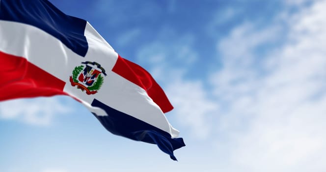 Detail of the national flag of the Dominican Republic waving in the wind on a clear day. Democracy and politics. 3d illustration render. Selective focus. Fluttering fabric