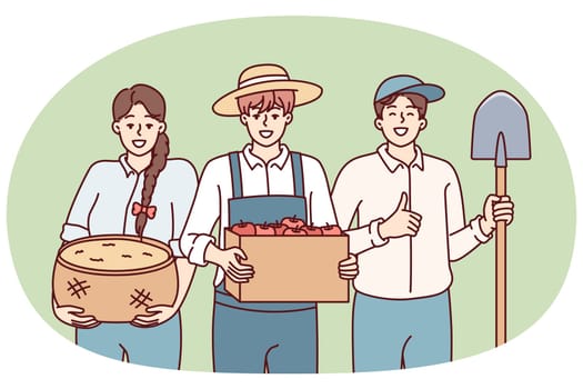 Woman and man dressed as farmers smiling rejoicing at harvest or good sales at organic food agricultural fair. People working in agricultural sector with grown products and shovel in hands
