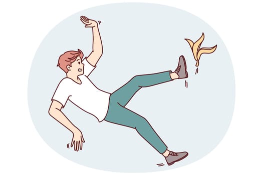 Clumsy man slipped on banana peel while walking through city streets or home rooms. Unfortunate casual guy slipped due to debris and is at risk of injury or broken arms and legs in fall