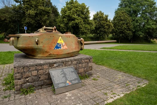 Bastogne, Belgium - July 17 2021: Lateral view of American tank turret with 10th Armored Division patch remembering the Battle of the Bulge in the second world war