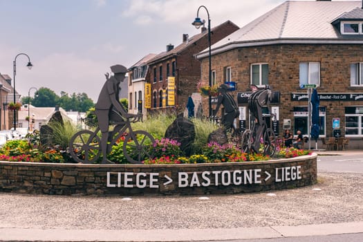 Bastogne, Belgium - July 17 2021: Statue for the Liege Bastogne Liege pro cycling race roundabout turning point in Bastogne. The race is called "La Doyenne"" (French for ""The old lady"") because it's the oldest of the 5 monuments."