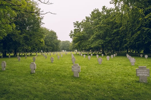 Bastogne, Belgium - July 17 2021: Panoramic view on graves at the German war cemetery in Bastogne, most of the buried died during the Battle of The Bulge in the Ardennes