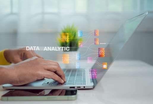 Business woman using computer for development and Analytics Data technology management System for report marketing strategy planning. graph analysis and information on a futuristic virtual screen.