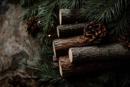 A cozy arrangement of logs and pinecones amidst evergreen branches creates a warm winter atmosphere perfect for seasonal decoration.