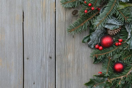 Fresh evergreen branches and vibrant ornaments create a festive atmosphere perfect for holiday celebrations and decorations at home.