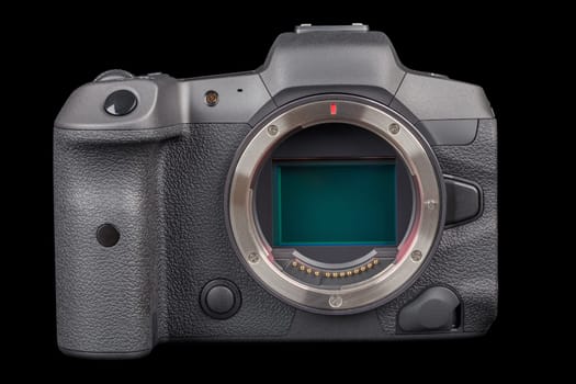 black 2020s professional 35mm full-frame mirrorless camera body with flip screen isolated on black background.
