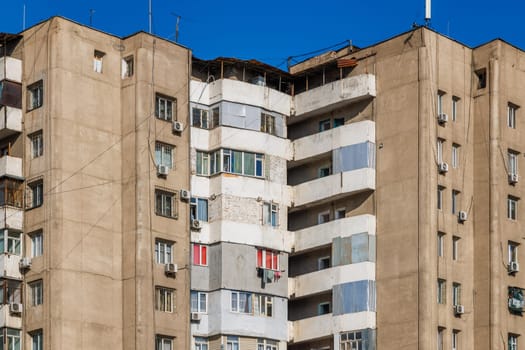 poor multistory apartment building at sunny day in Bishkek, Kyrgyzstan