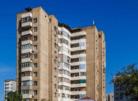 poor multistory apartment building at sunny day in Bishkek, Kyrgyzstan