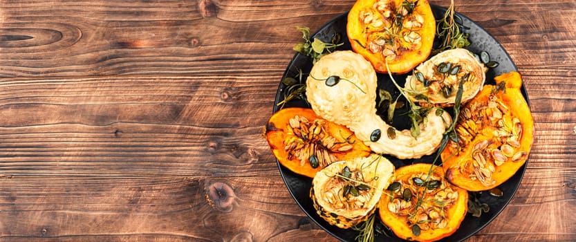Delicious baked or butternut squash pumpkin with herbs.