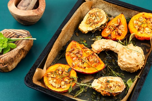 Delicious baked or butternut squash pumpkin with herbs.