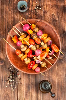 Shashlik kebab from fresh vegetables on wooden skewers.Vegan food concept.