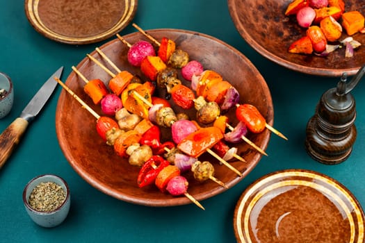 Shashlik kebab from fresh vegetables on wooden skewers.Vegan food concept.