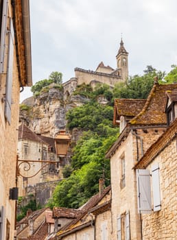 View from the main street at the bottom of the village of Rocamadour, a famous cliffside village, Lot, Occitanie, France