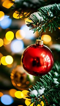 Sparkling ornament balls in vibrant red and gold hang from a lush spruce tree branch. Soft, warm lights twinkle enhancing festive spirit of Christmas. Happy New Year. Anamorphic  bokeh. Generative AI.