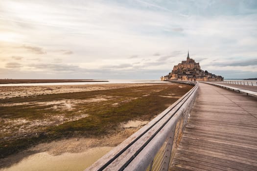 Le Mont-saint-michel photographed in winter from his long bridge in Normandy, France