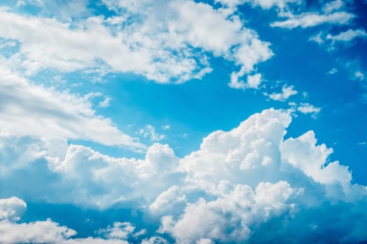 Stunning cloud formation, blue sky decorated with white fluffy clouds, natural photography background taken in France