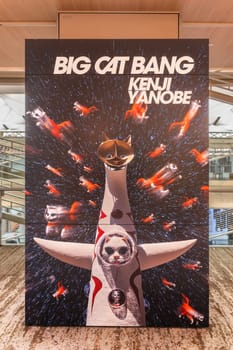 ginza, tokyo - may 14 2024: Contemporary art exhibit poster at Ginza Six featuring the 'Big Cat Bang' installation created by Japanese artist Kenji Yanobe showcasing whimsical cat-themed creations.
