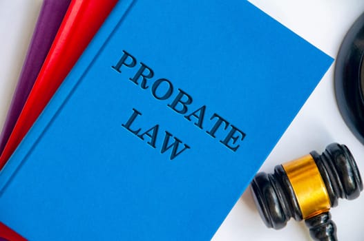 Top view of Probate Law on blue book with gavel on white background.