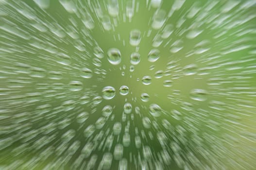 Clear raindrops on clear glass with zoom effect. Raindrop concept.