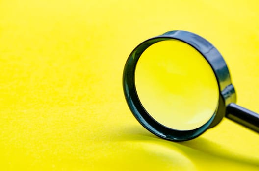 Close up of magnifying glass with customizable space for text or ideas.