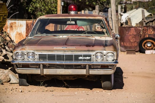 Hackberry, Arizona, United states, November 17th 2013: Illustrative Editorial: rusty Chevrolet Impala with a red light on top, parked in a yard