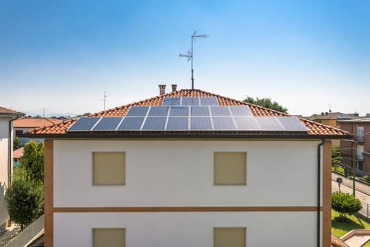 Renewable energy house with solar and thermal photovoltaic panels on roof