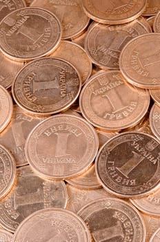 Large pile of big golden coins. Financial success money background for rich life concepts, banking and profit in Ukraine