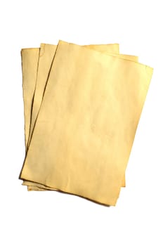 Few old blank pieces of antique vintage crumbling paper manuscript or parchment vertically oriented isolated on white