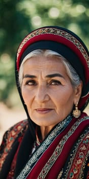 A mature Tajik woman 75 years old, gazes directly showcasing intricate traditional attire, rich cultural heritage of her nationality, evoking wisdom and grace. Brunette woman, wearing a headscarf. AI