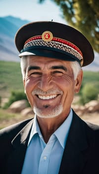 A joyful Tajik man 75 years old wearing traditional clothing stands outdoors with a broad smile against a natural backdrop on a sunny day. A resident of Tajikistan smiles. Generated by AI