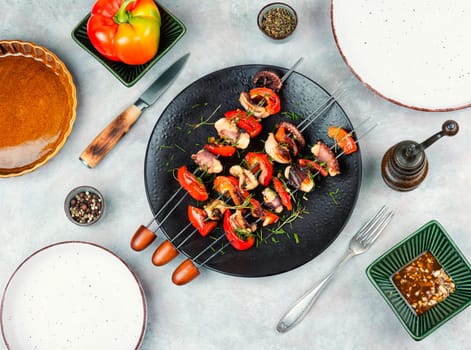 Delicious octopus dish, grilled octopus on skewers. Skewers of squid tentacles, octopus.