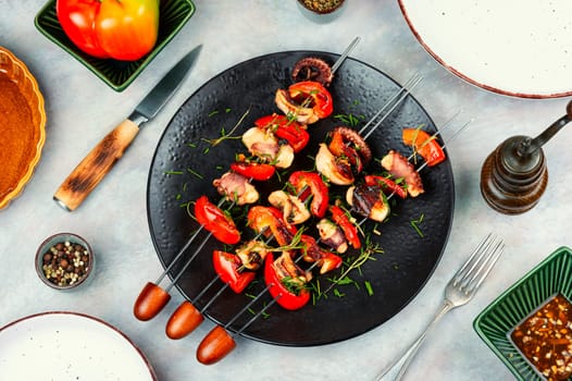 Delicious octopus dish, grilled octopus on skewers. Skewers of squid tentacles, octopus.