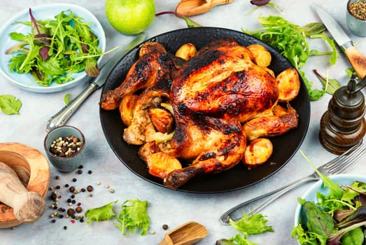 Delicious looking freshly roasted chicken. Braised chicken with aromatic herbs.
