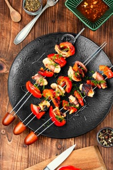 Grilled octopus, grilled squid on skewers, barbecue or BBQ squid, Grilled squid skewers. Top view.