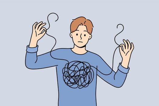 Man confused in himself and in feelings, shows lump of threads in chest and needs help of psychotherapist. Guy confused and cannot independently deal with mental health, suffered due to depression.