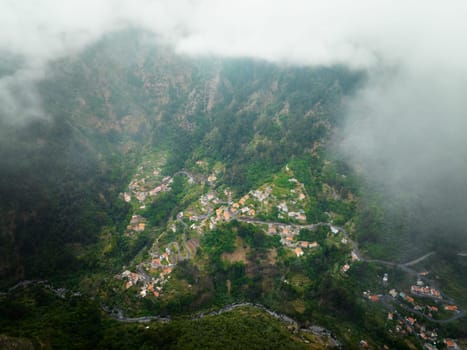 Aerial drone view of Curral das Freiras village in Valley of the Nuns from Miradouro da Eira do Serrado, Madeira island, Portugal