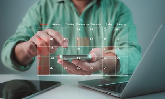 Businessman marking dates on virtual calendar, Time management concept, Planning work to increase efficiency, Business project planning, Effective time management and reduce working time.