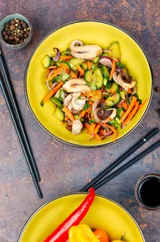 Thai spicy squid or calamari salad in plate. Space for text.
