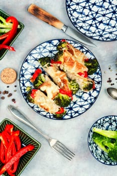 Meat rolls or roulades stuffed with broccoli and peppers. Meat with vegetable filling.