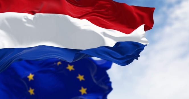 Flags of the Netherlands and the European Union waving in the wind on a clear day. Member of the EU in 1958. 3d illustration render. Fluttering fabric. Selective focus.