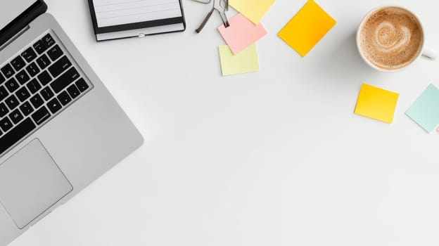 Minimalist desk setup with laptop, coffee, and colorful sticky notes on white background, ideal for remote work and productivity concept.