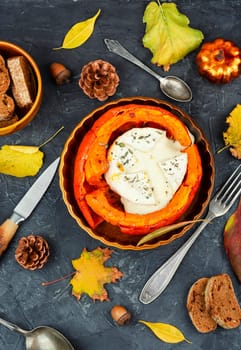 Halved roasted squash filled with spicy and camembert cheese.