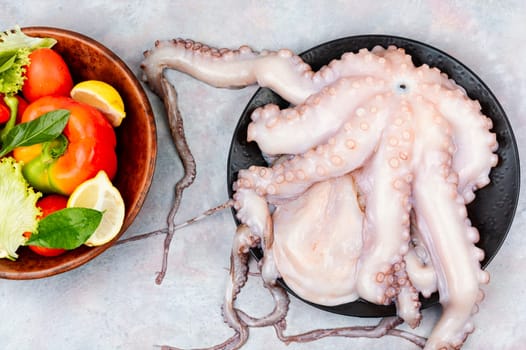Fresh raw octopus. Concept healthy food, Mediterranean diet and seafood.