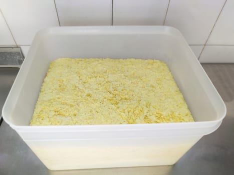 Professional Flaked instant mashed potatoes at plastic fiber container. Selective focus