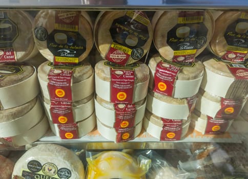 Caceres, Spain - Feb 14th, 2023: Torta del Casar cheeses displayed in a shop window